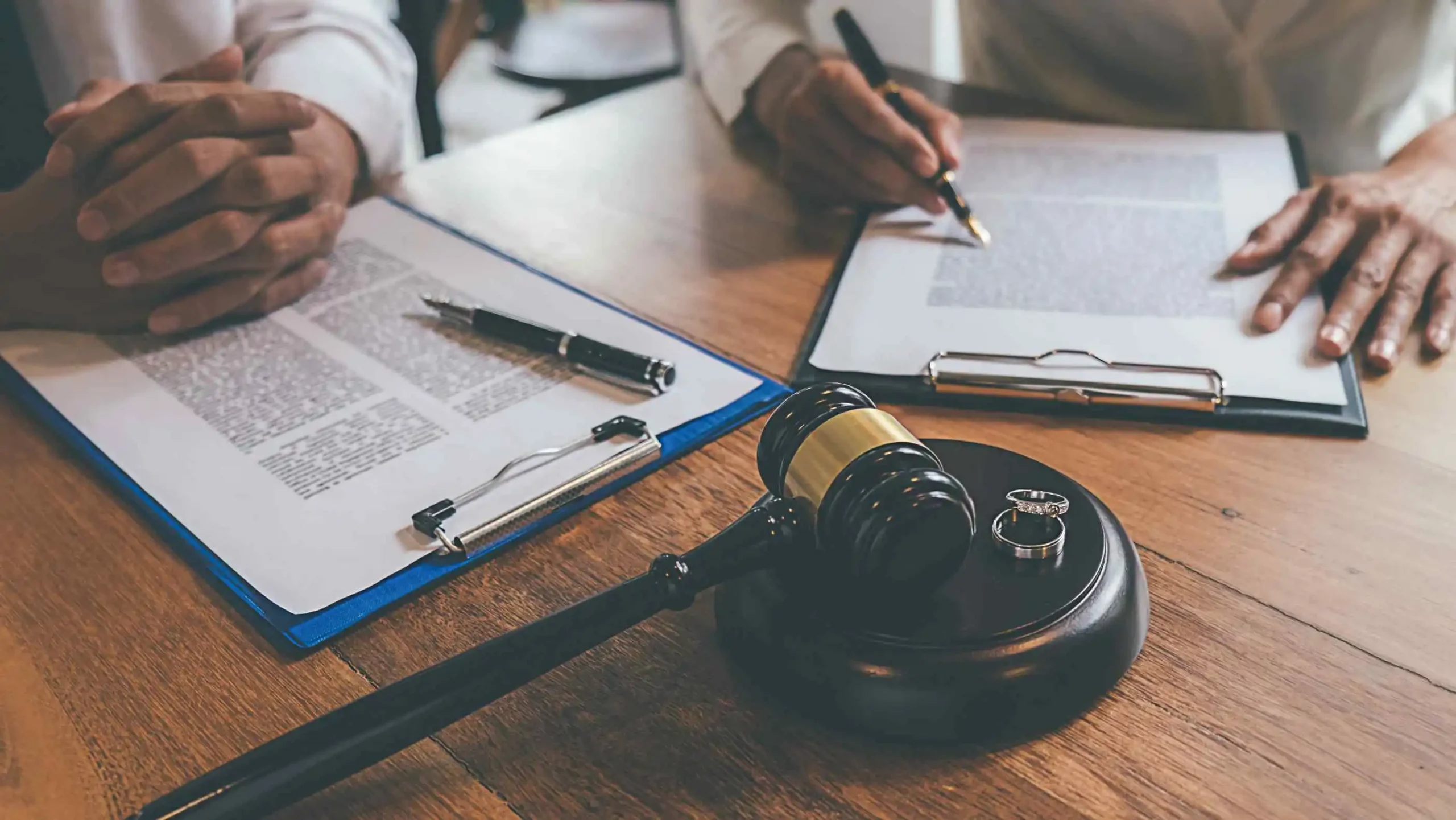 Judge gavel and lawyers in divorce consultation.